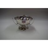An Edwardian silver three handled pedestal bowl, by Williams Birmingham Ltd, 1906,14.