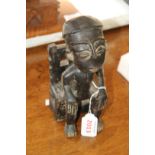 African: a Nigerian carved seated figure.