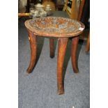 African: an East African four leg stool, with stylised bead inlaid, 35.5cm diameter.