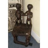 African: a Chokwe chair, with twin figure back and front supports.