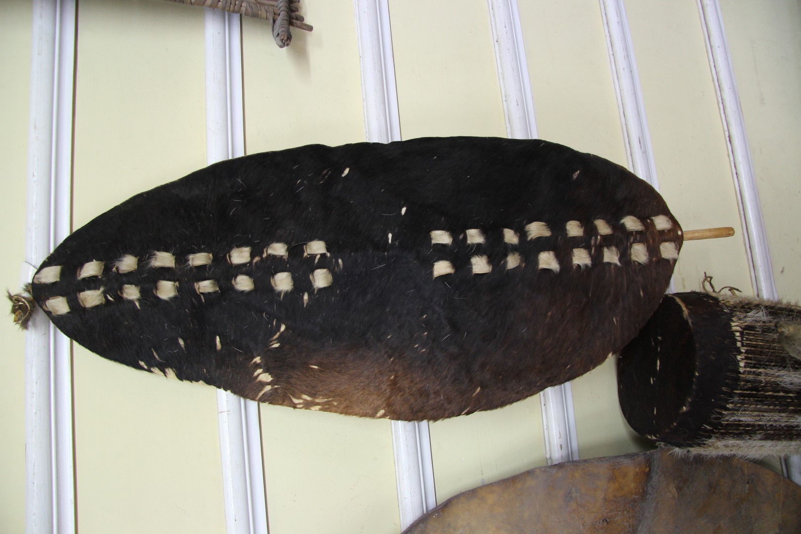 African: a skin drum; together with similar shield and spear, probably Zambia. - Image 4 of 7