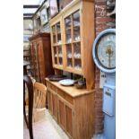 An old pine dresser and rack, 135cm wide.