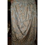 Two pairs of large pale blue damask curtains.