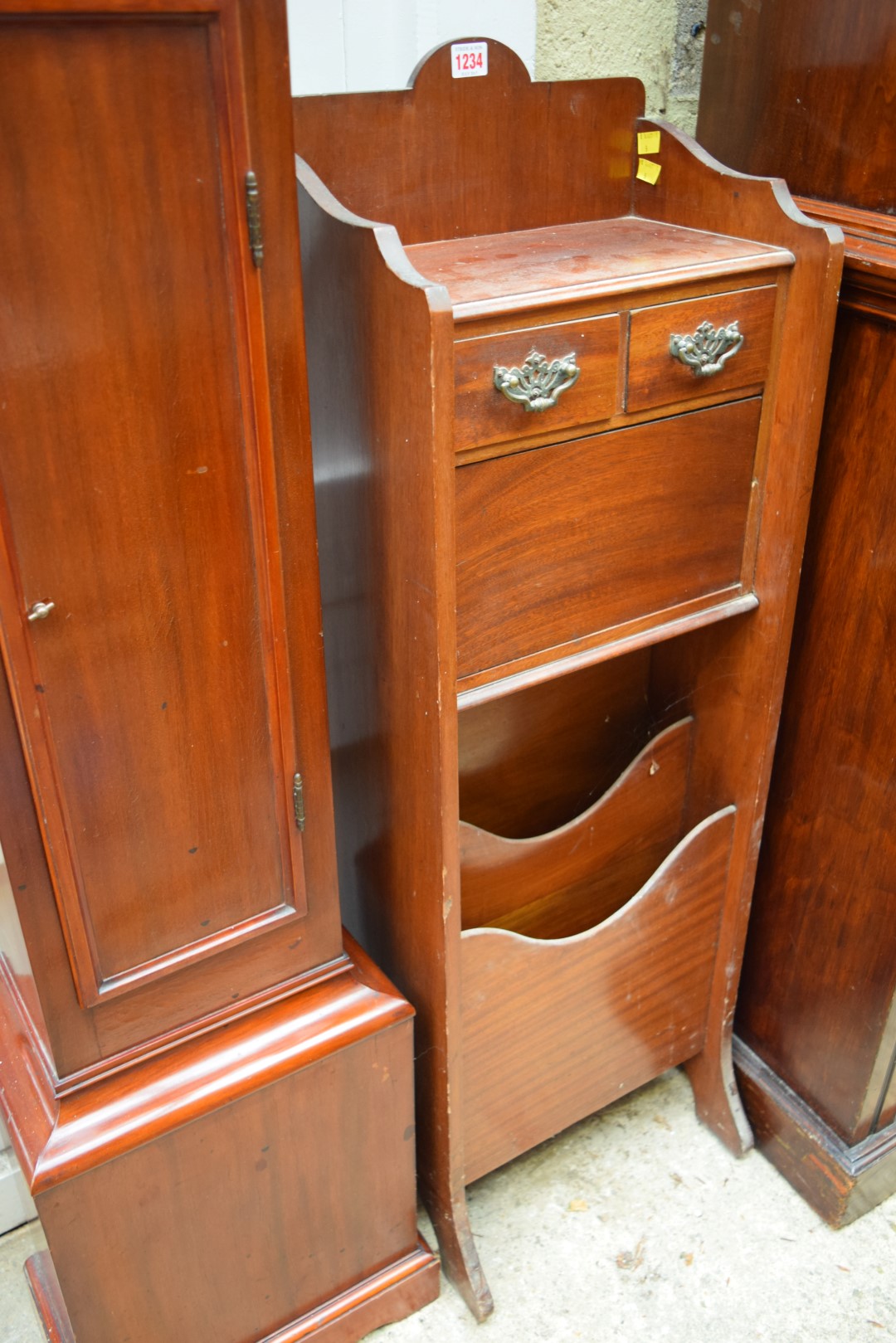 An unusual mahogany side cabinet, with Canterbury base, 36cm wide.