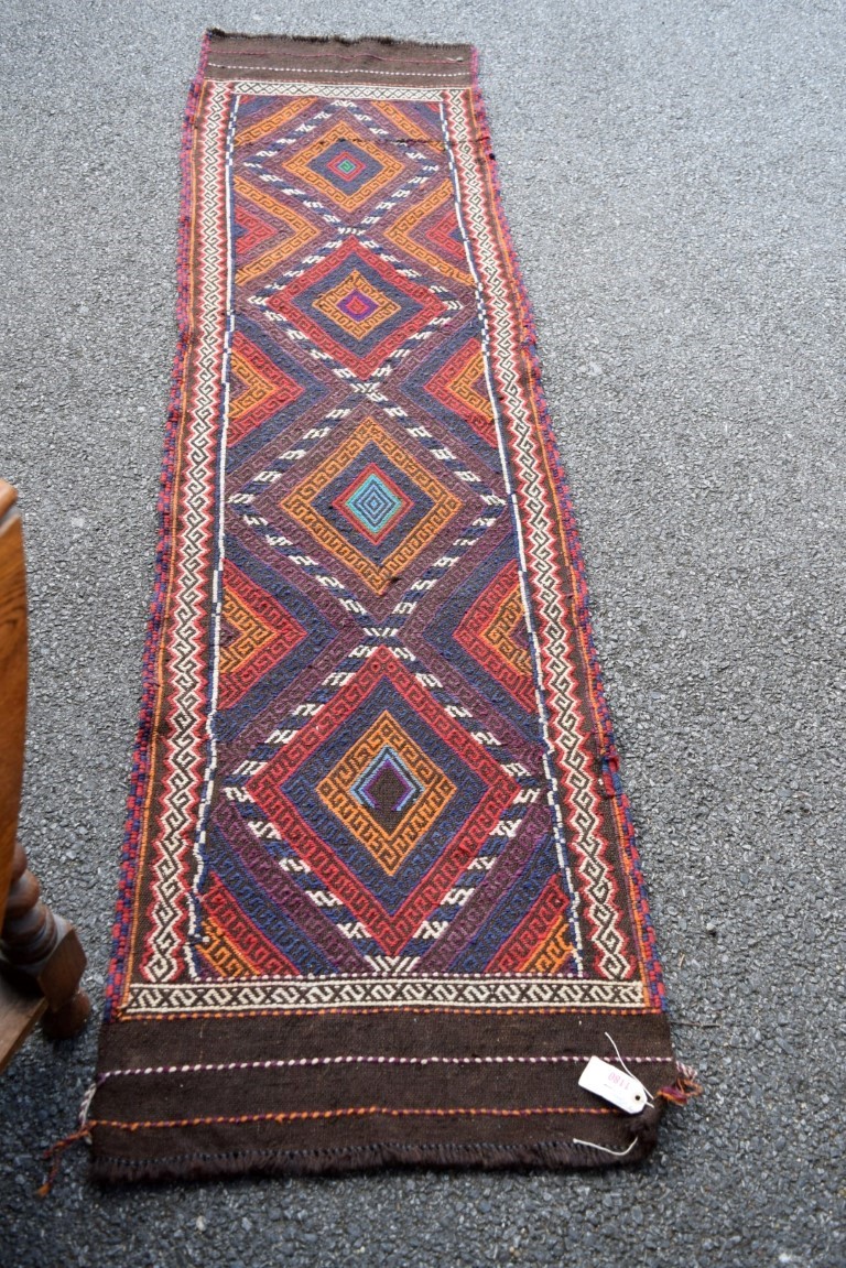 A narrow Baluch flatweave runner, 234 x 63cm. - Image 4 of 16