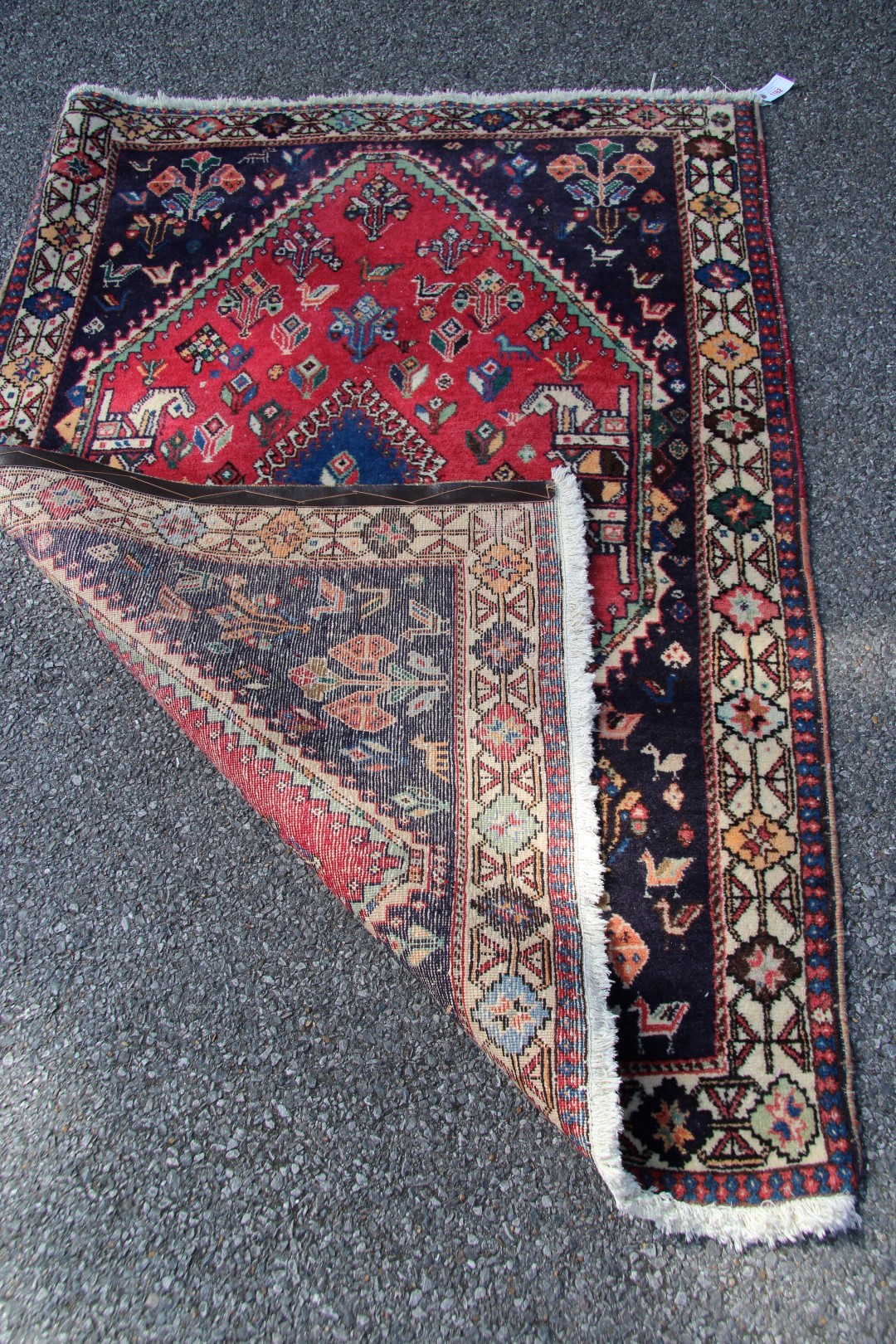 A Persian Qashgai rug, with central medallion and stylised flowers, birds and four horse heads, - Image 14 of 16