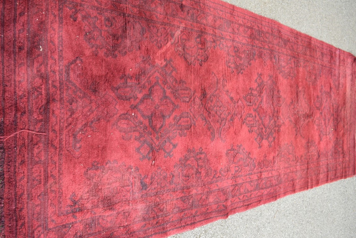 A Turkish Kelleh narrow carpet, with allover geometric design on a rich red field, 383 x 153cm. - Image 7 of 16