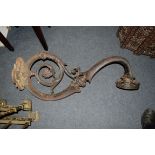 A substantial Victorian cast iron gas wall bracket, 100cm wide.