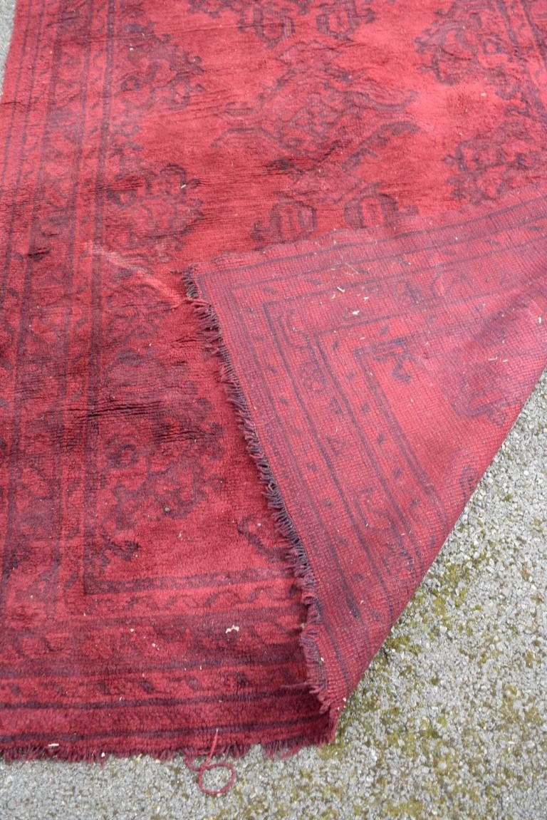 A Turkish Kelleh narrow carpet, with allover geometric design on a rich red field, 383 x 153cm. - Image 16 of 16