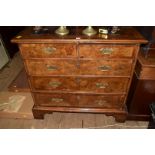 An 18th century walnut and crossbanded chest of drawers, 101cm wide.
