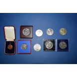 A small collection of commemorative coins and medals,