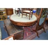 A 19th century mahogany and satinwood crossbanded circular drum table,