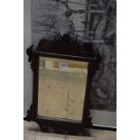 An antique mahogany fret framed wall mirror, 48 x 30cm.