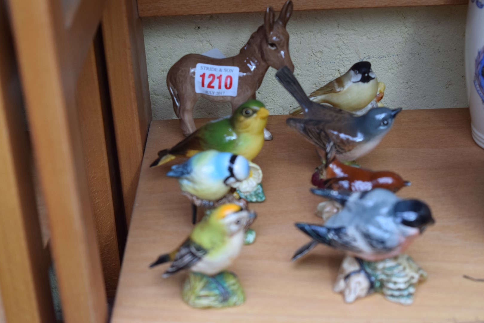 Six Beswick birds; together with a Royal Worcester bird; and a Beswick donkey.
