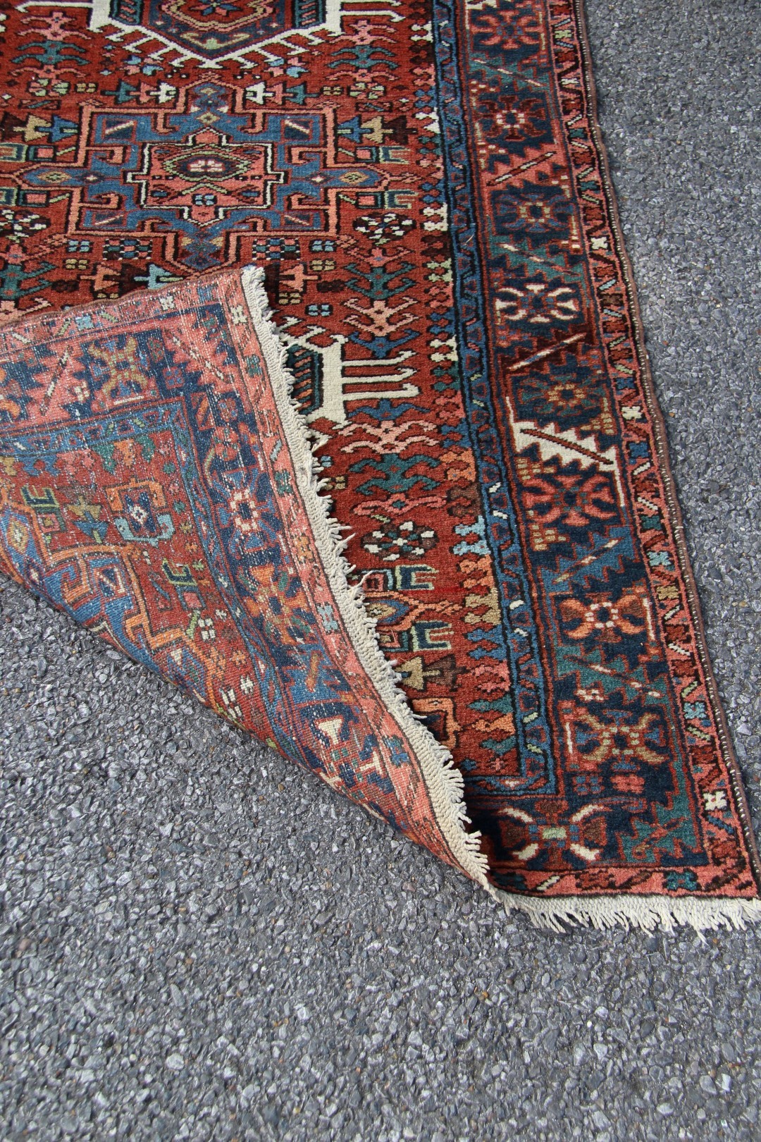 A North West Persian Karaja runner, with seven medallions on a geometric design red field, - Image 14 of 18