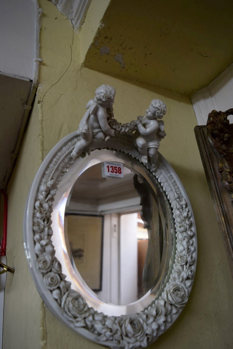 A Sitzendorf blanc de chine oval wall mirror, with cherub surmount, 33cm high. - Image 3 of 8
