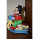 A Modern Toys tinplate figure of Mickey Mouse on a scooter, 23cm high.