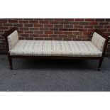 An antique Continental mahogany day bed, 190cm wide.