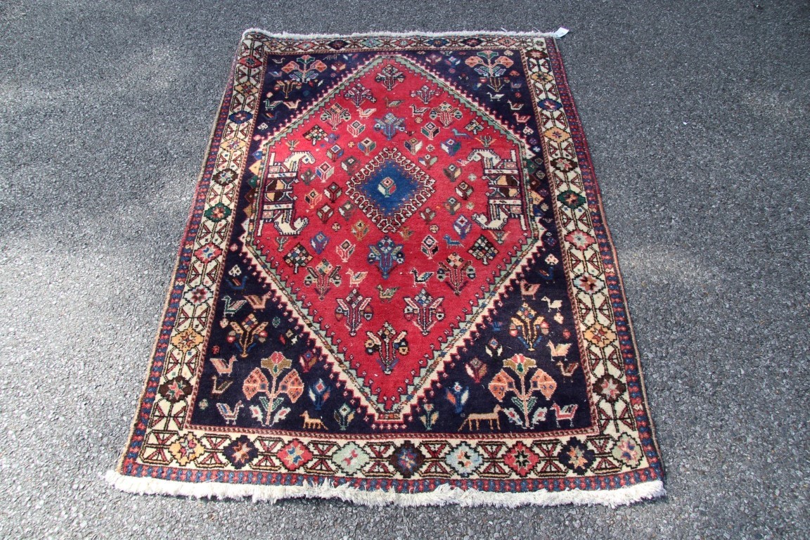 A Persian Qashgai rug, with central medallion and stylised flowers, birds and four horse heads, - Image 4 of 16