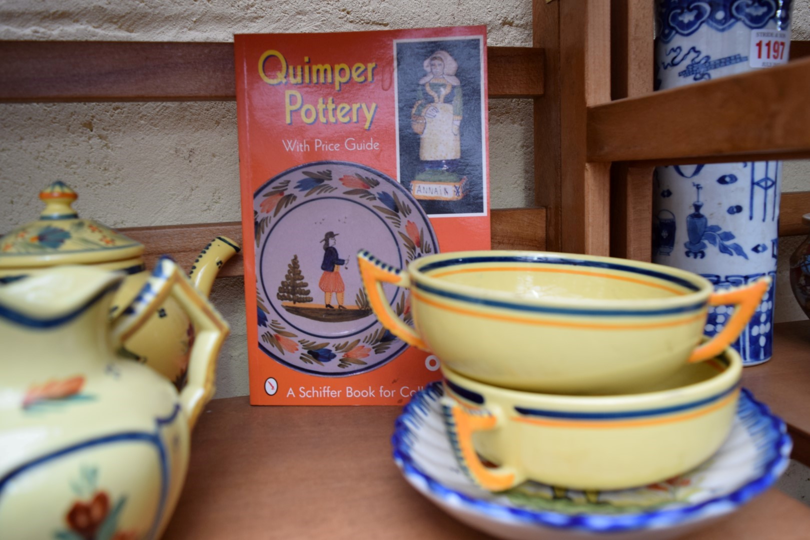 *WITHDRAWN FROM SALE*A collection of ten items of Quimper ware pottery, together with price guide. - Image 16 of 22