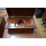 A Victorian figured mahogany tea caddy, of waisted sarcophagus form, 34cm wide.