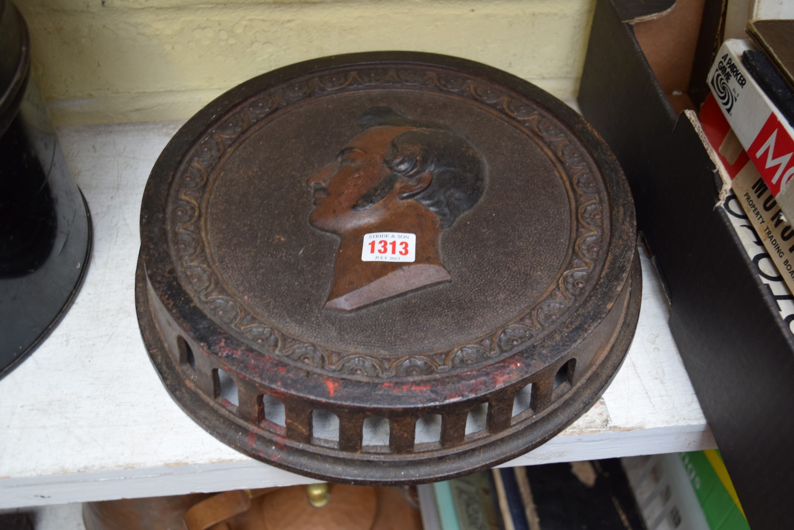 A cast iron portrait plaque, 31cm diameter.