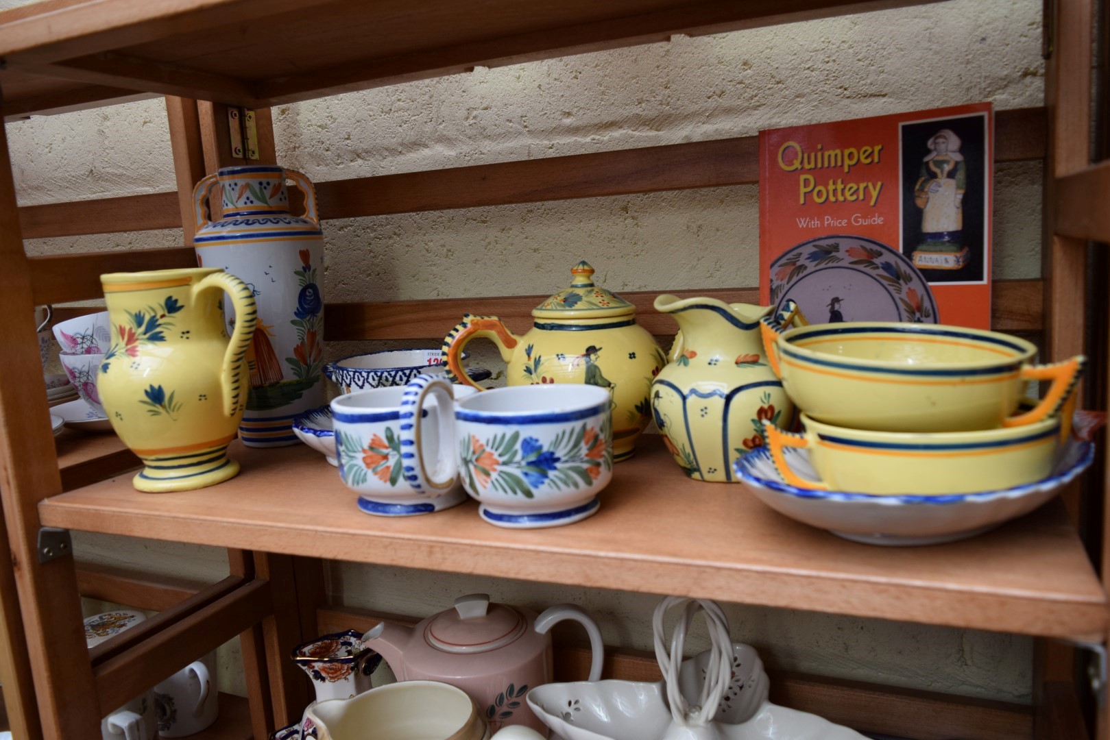 *WITHDRAWN FROM SALE*A collection of ten items of Quimper ware pottery, together with price guide. - Image 4 of 22