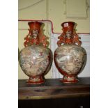A pair of Japanese Satsuma twin handled vases, 40cm high.