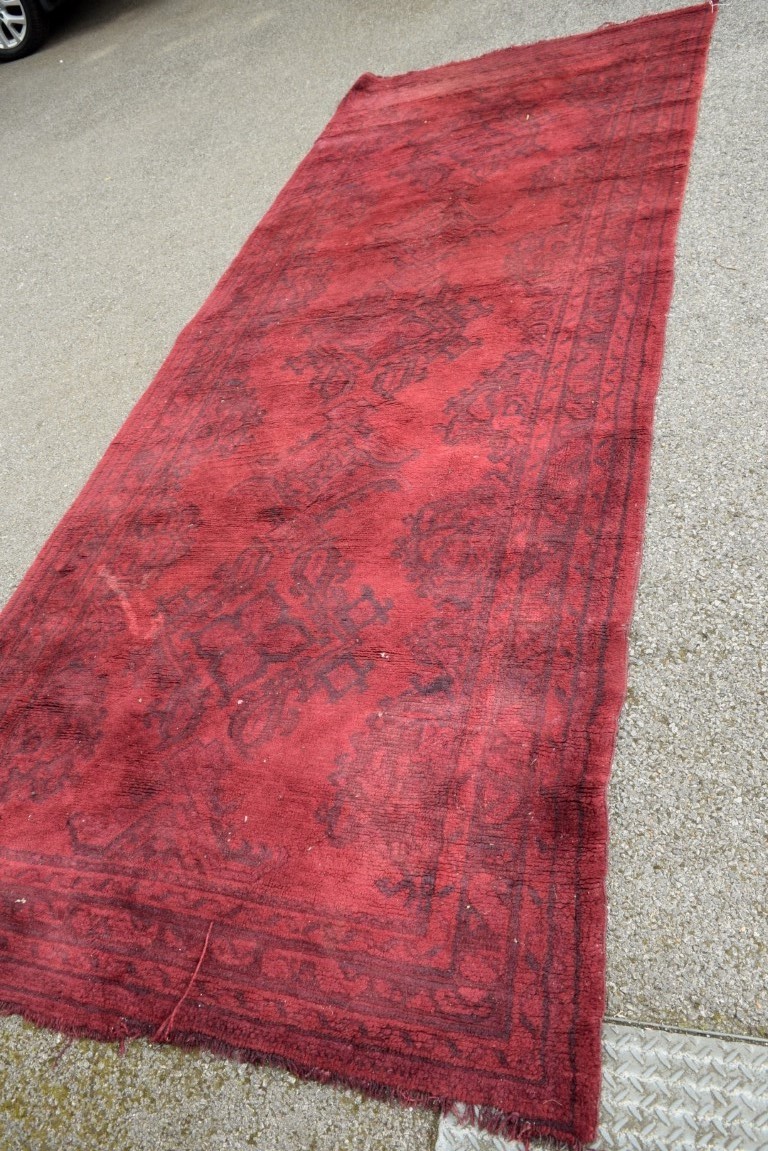 A Turkish Kelleh narrow carpet, with allover geometric design on a rich red field, 383 x 153cm. - Image 4 of 16