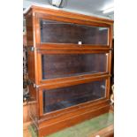 An early 20th century Globe Wernicke style mahogany three tier sectional bookcase, 89cm wide.