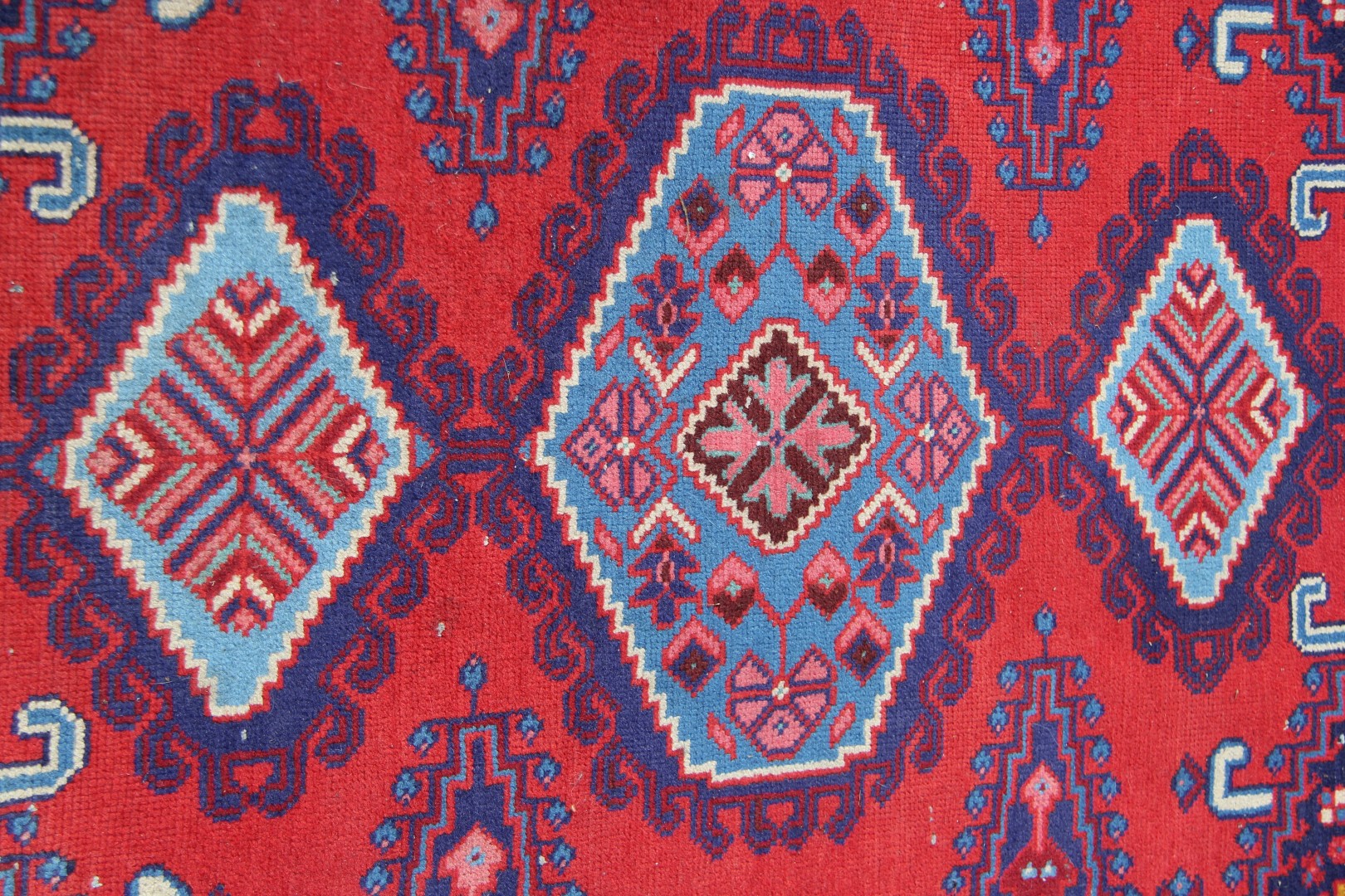 A North West Persian triple medallion rug on a red field, 151 x 105cm. - Image 9 of 16