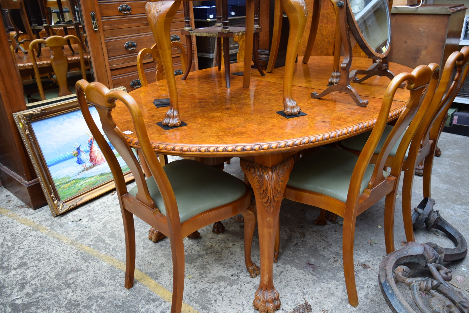 A burr walnut dining suite, comprising: an extending dining table, approx 235.