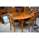 A burr walnut dining suite, comprising: an extending dining table, approx 235.