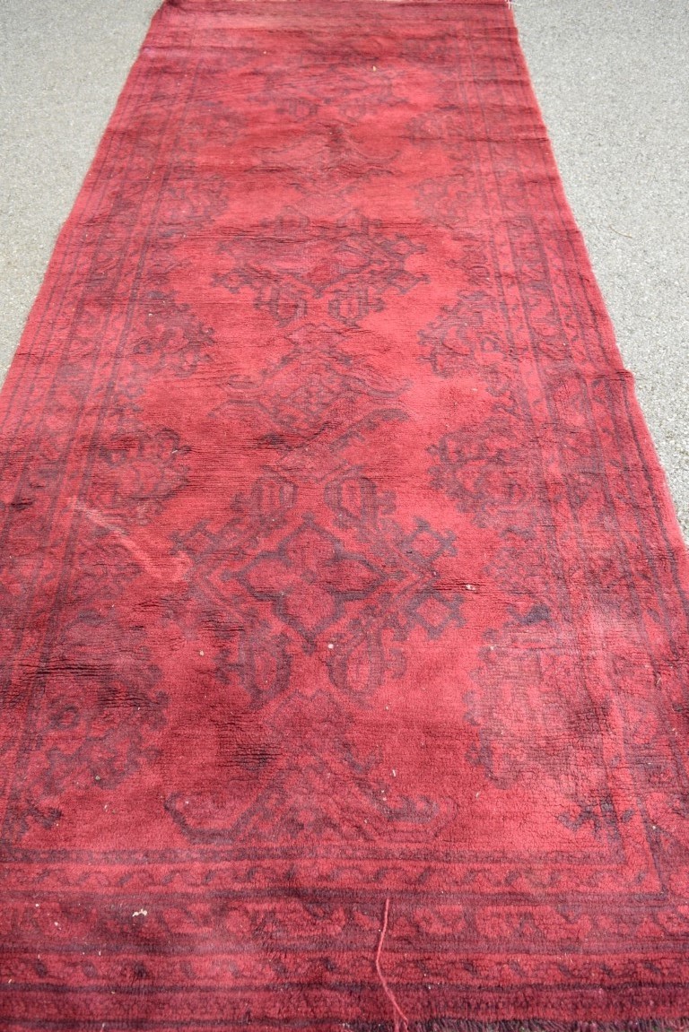 A Turkish Kelleh narrow carpet, with allover geometric design on a rich red field, 383 x 153cm. - Image 8 of 16