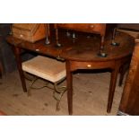 A late George III mahogany D end dining table, with one central leaf, 167.5cm extended.