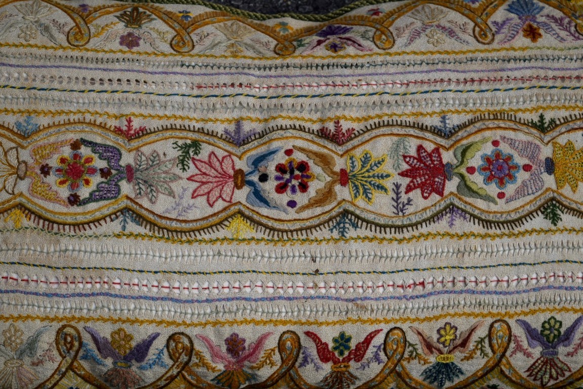 A crewel work cushion with stylised needlework decoration, 92 x 49cm. - Image 8 of 8