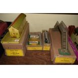 Four Hornby O gauge boxed items, comprising: No.3 station; No.1 level crossing; No.