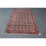 A Baluchi rug, with allover geometric design, 194 x 124cm.