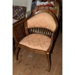 An Edwardian mahogany and inlaid tub chair.