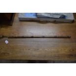 An antique bamboo, boxwood and brass novelty horse measure walking cane, 175cm extended.