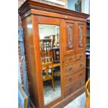 A late Victorian carved walnut wardrobe, 165cm wide.