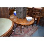 A Victorian burr walnut oval tilt-top loo table, 151.5cm wide.