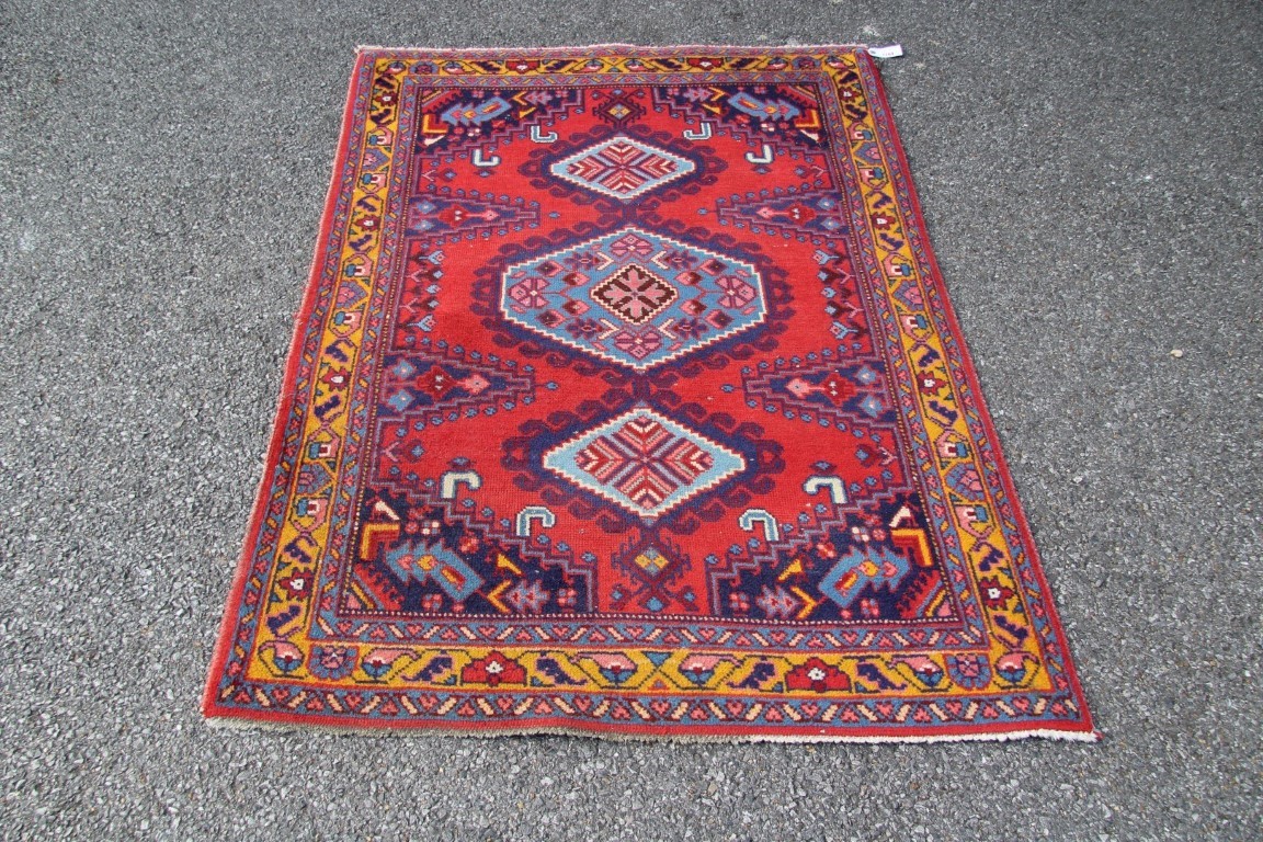 A North West Persian triple medallion rug on a red field, 151 x 105cm. - Image 3 of 16