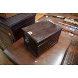 A Chinese hardwood table cabinet, 19th century, with metal mounts and side carrying handles,