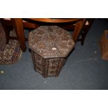 A carved and pierced walnut octagonal occasional table, with fruiting vine decoration, 45cm wide.