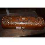A Victorian rosewood and mother of pearl inlaid glove type box, 25cm wide.