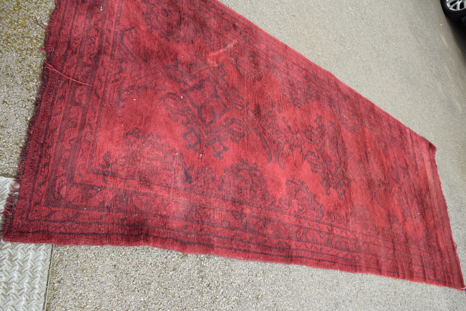 A Turkish Kelleh narrow carpet, with allover geometric design on a rich red field, 383 x 153cm.