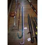 Two antique Nailsea glass novelty walking canes, largest 100cm long.