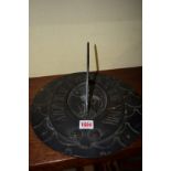 An antique bronze sundial, possibly 18th century, relief moulded with Old Father Time,