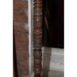 An unusual carved and turned wood tripod standard lamp.